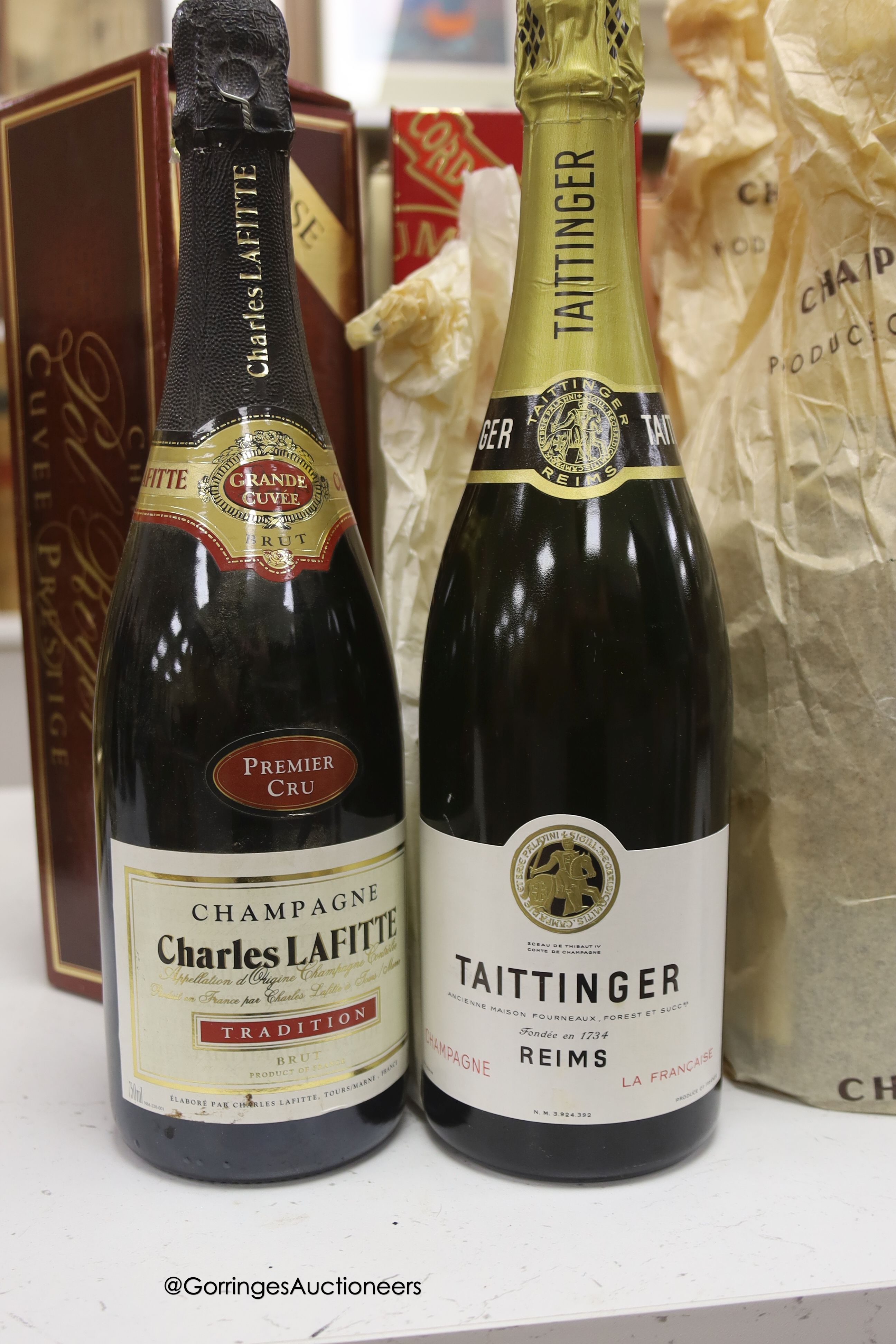 Twelve assorted bottles of champagne including Lanson Pol Roger Jean Rocher and wine related items